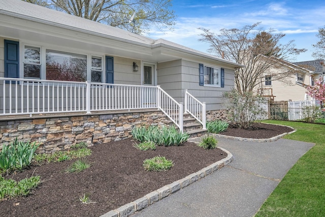 property entrance with covered porch