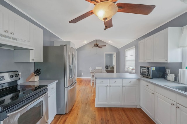 kitchen with under cabinet range hood, ceiling fan, a peninsula, white cabinets, and appliances with stainless steel finishes