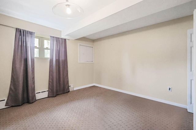 spare room featuring baseboards