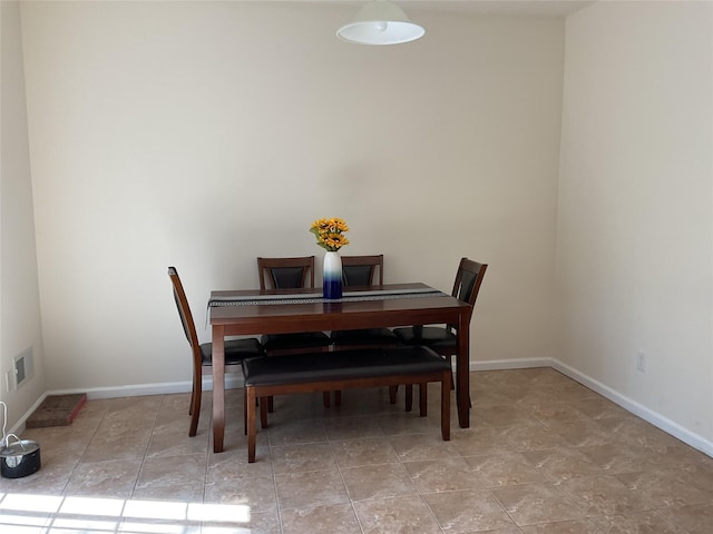 dining room with baseboards and visible vents