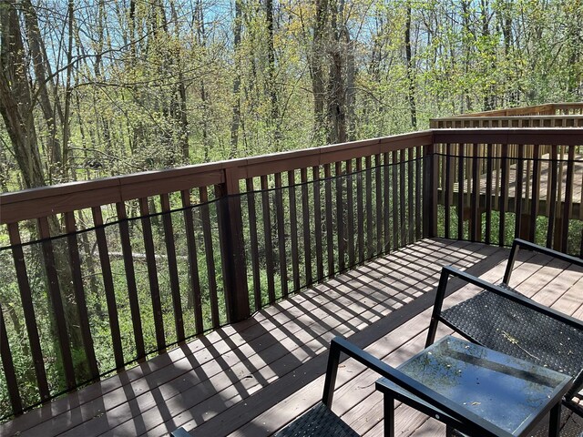 wooden terrace with a forest view