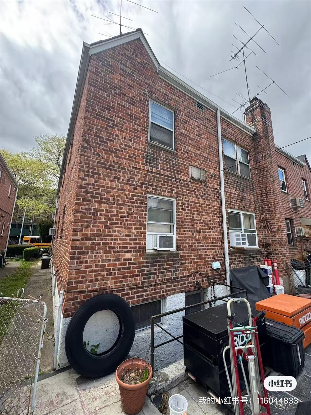 rear view of property featuring brick siding