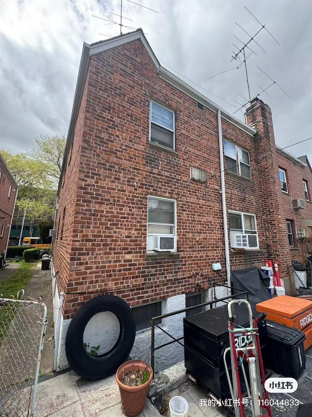 rear view of property featuring brick siding