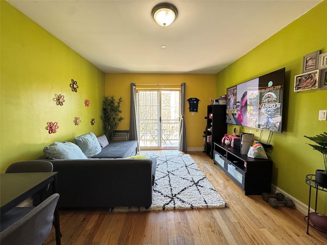 living room with wood finished floors and baseboards
