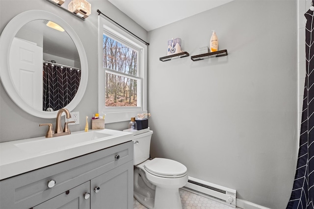 bathroom featuring tile patterned flooring, a baseboard radiator, toilet, vanity, and baseboards