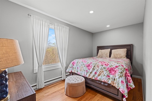 bedroom featuring wood finished floors and recessed lighting
