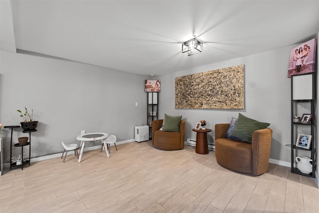 living area featuring wood finished floors and baseboards
