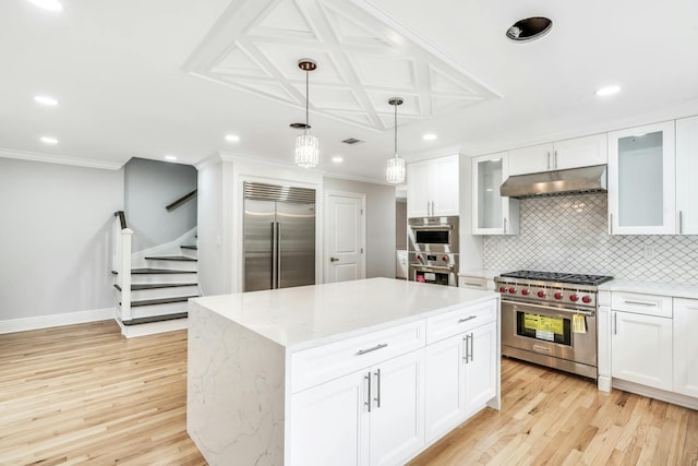 539 Split Rock Rd, Syosset, NY 11791 - kitchen featuring decorative backsplash, high end appliances, under cabinet range hood, recessed lighting, and light wood-style flooring