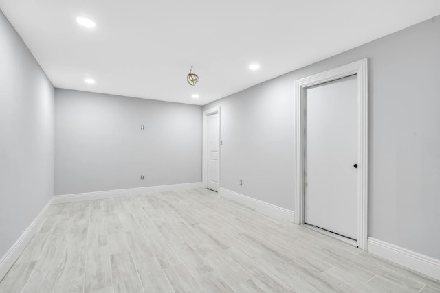 539 Split Rock Rd, Syosset, NY 11791 - below grade area with baseboards, recessed lighting, and light wood-style flooring