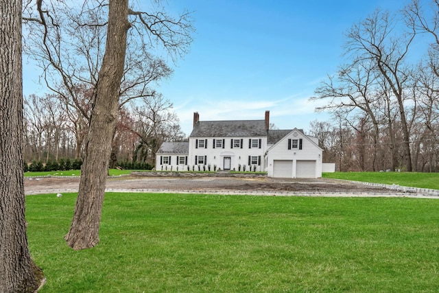 539 Split Rock Rd, Syosset, NY 11791 - colonial home featuring a garage, a chimney, and a front yard