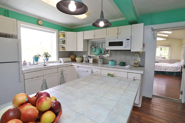kitchen featuring tile counters, white cabinetry, dark wood-style flooring, white appliances, and tasteful backsplash