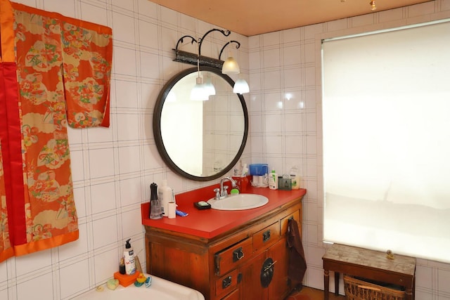 bathroom featuring tile walls and vanity