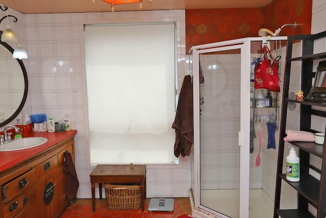 full bath featuring a shower stall, tile patterned flooring, and vanity