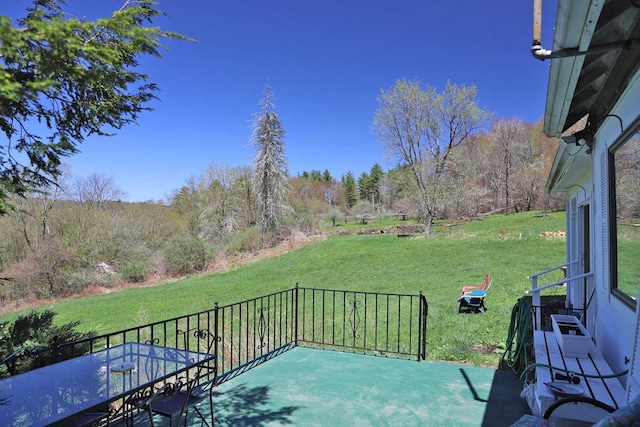view of patio / terrace with a forest view
