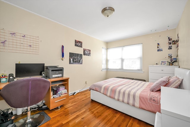 bedroom featuring wood finished floors
