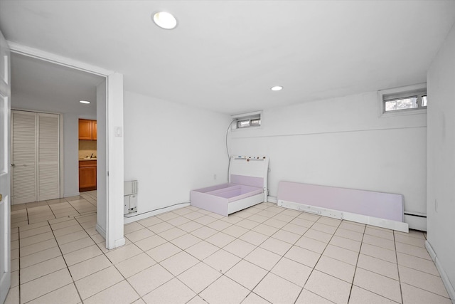interior space with baseboards, recessed lighting, and a baseboard radiator