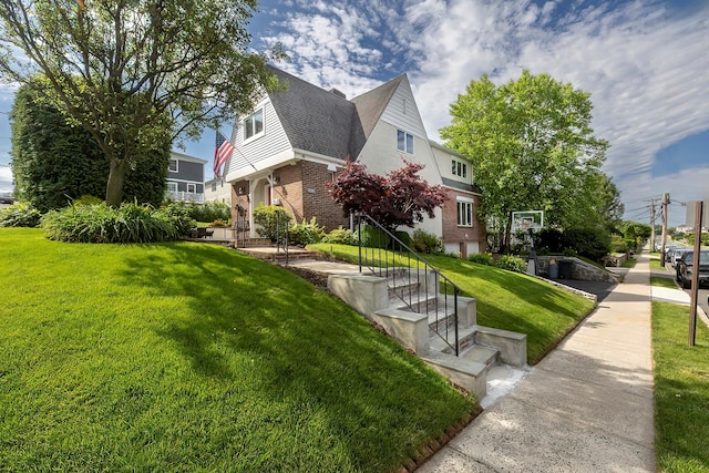 126 Lincoln Ave E, West Harrison, NY 10604 - view of side of home with a lawn and brick siding