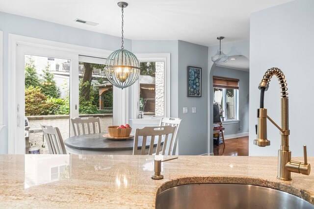 126 Lincoln Ave E, West Harrison, NY 10604 - interior space with visible vents and an inviting chandelier
