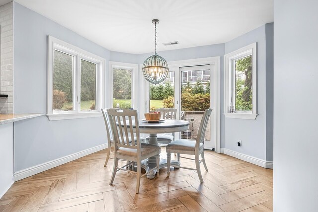 126 Lincoln Ave E, West Harrison, NY 10604 - dining space featuring visible vents, a chandelier, and baseboards