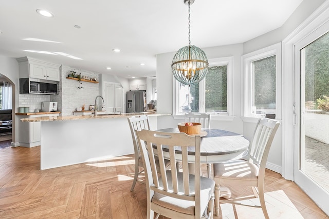 126 Lincoln Ave E, West Harrison, NY 10604 - dining room with baseboards, recessed lighting, and a notable chandelier