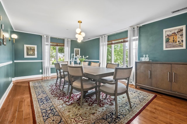 126 Lincoln Ave E, West Harrison, NY 10604 - dining room with visible vents, wood finished floors, ornamental molding, and baseboards