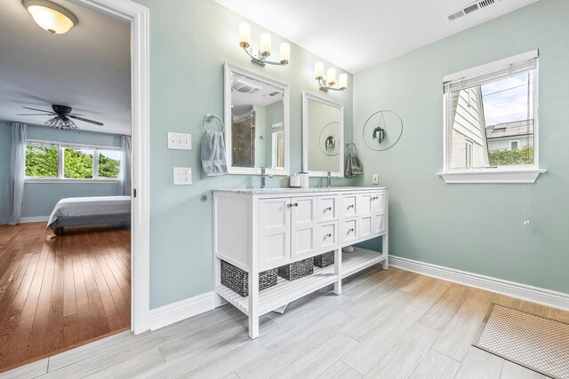 126 Lincoln Ave E, West Harrison, NY 10604 - bathroom featuring wood finished floors, visible vents, a ceiling fan, and baseboards
