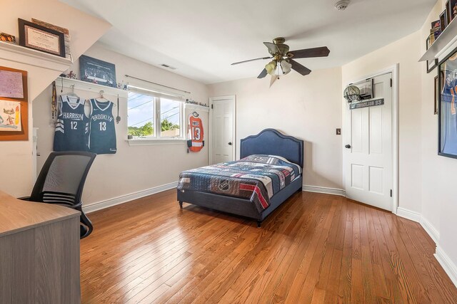 126 Lincoln Ave E, West Harrison, NY 10604 - bedroom with baseboards, visible vents, ceiling fan, and wood-type flooring