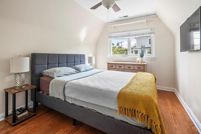 126 Lincoln Ave E, West Harrison, NY 10604 - bedroom with baseboards, visible vents, wood finished floors, and lofted ceiling