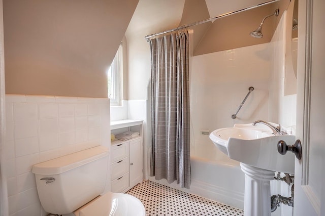 126 Lincoln Ave E, West Harrison, NY 10604 - full bath featuring toilet, shower / bath combination with curtain, tile walls, and a wainscoted wall