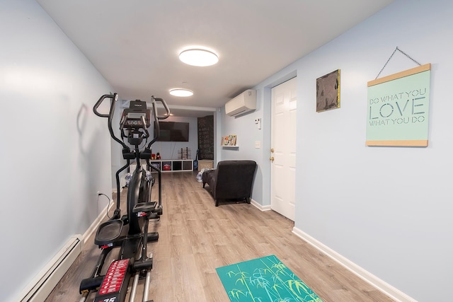 126 Lincoln Ave E, West Harrison, NY 10604 - workout room with baseboards, a baseboard heating unit, light wood finished floors, and a wall mounted AC