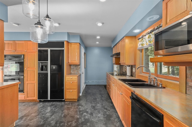 kitchen featuring a sink, black appliances, pendant lighting, a baseboard radiator, and under cabinet range hood