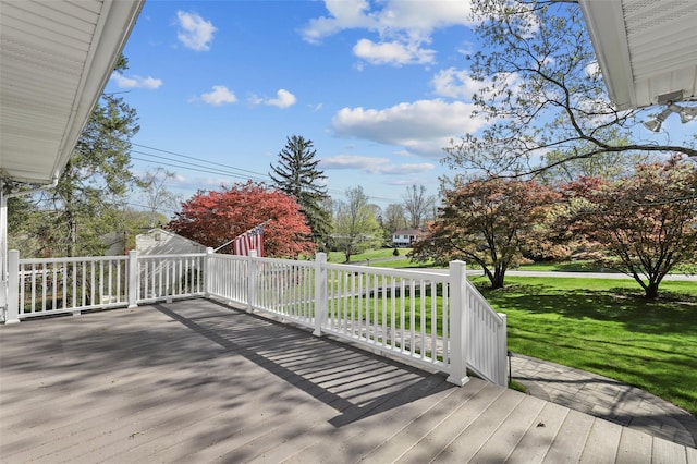 wooden terrace with a yard