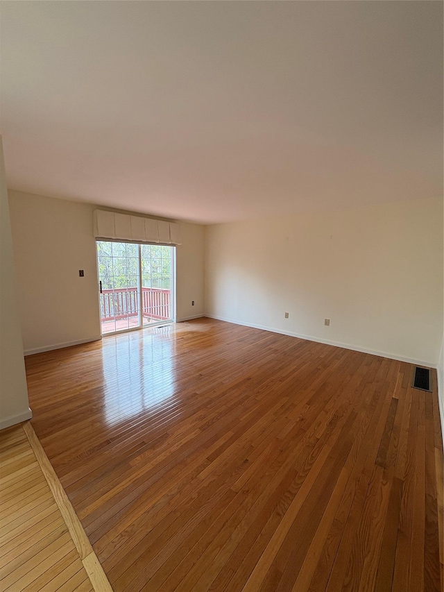 115 Turnberry Ct, Poughkeepsie, NY 12603 - spare room with baseboards, visible vents, and wood finished floors