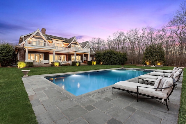 471 Middle Line Hwy, Sag Harbor, NY 11963 - pool at dusk with an outdoor pool, a yard, and a patio area