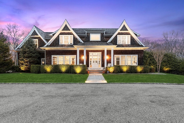 471 Middle Line Hwy, Sag Harbor, NY 11963 - view of front of house with a shingled roof and a front lawn