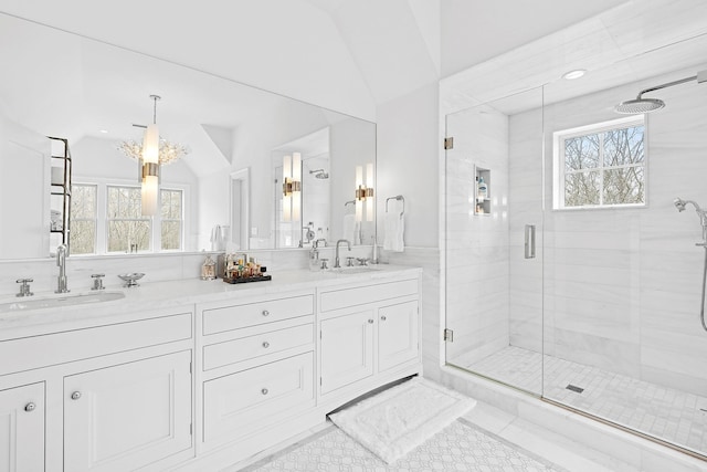 471 Middle Line Hwy, Sag Harbor, NY 11963 - full bath featuring double vanity, a sink, lofted ceiling, and a stall shower