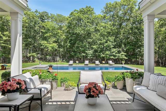 471 Middle Line Hwy, Sag Harbor, NY 11963 - outdoor pool featuring a patio area, a lawn, view of wooded area, and outdoor lounge area