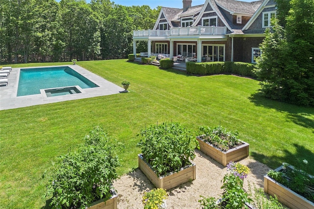 471 Middle Line Hwy, Sag Harbor, NY 11963 - view of grassy yard with a vegetable garden, a patio, an outdoor pool, and a balcony