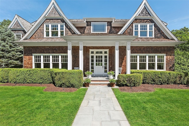 471 Middle Line Hwy, Sag Harbor, NY 11963 - shingle-style home featuring a front lawn and covered porch