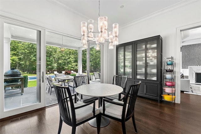471 Middle Line Hwy, Sag Harbor, NY 11963 - dining room featuring plenty of natural light, ornamental molding, dark wood finished floors, and a chandelier