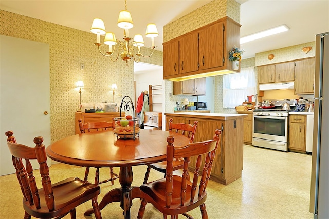 kitchen featuring wallpapered walls and appliances with stainless steel finishes