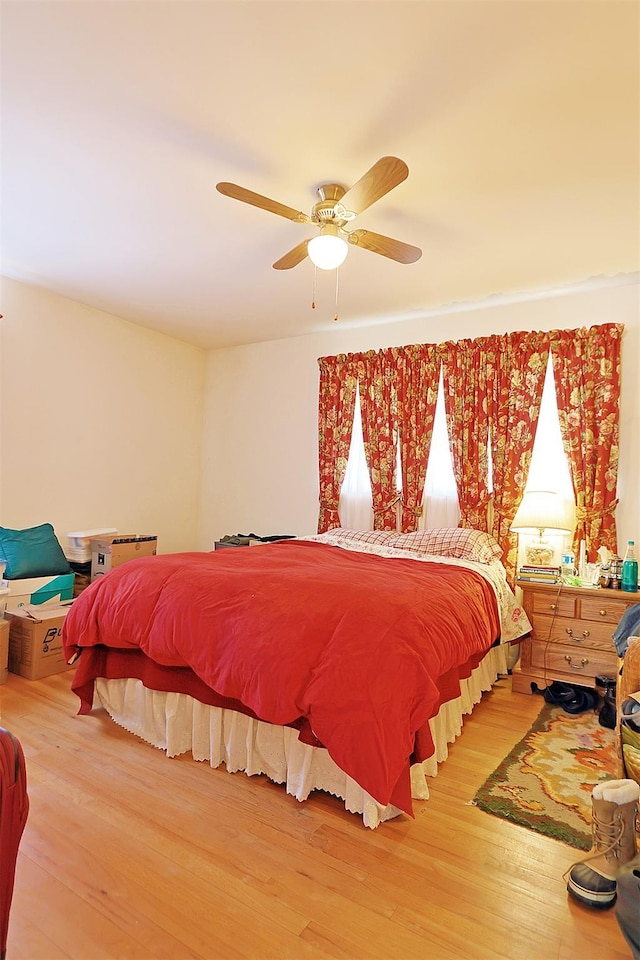 bedroom featuring ceiling fan and wood finished floors