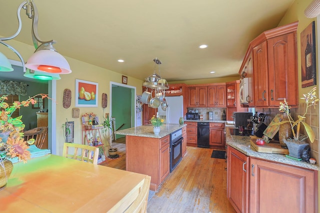 15 Hickory Hill Dr, Warwick, NY 10990 - kitchen with white appliances, backsplash, a center island, light wood-style floors, and pendant lighting