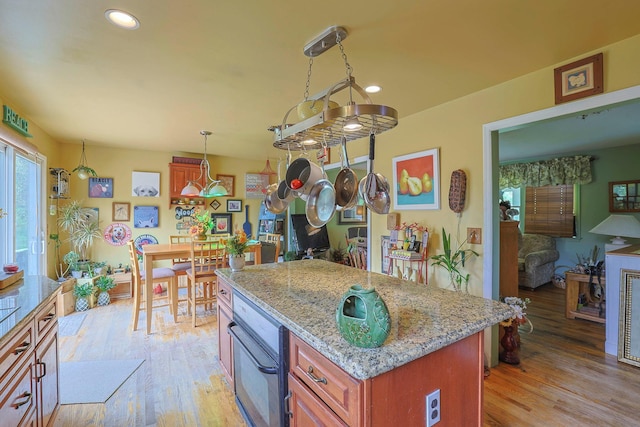 15 Hickory Hill Dr, Warwick, NY 10990 - kitchen with black oven, light wood-style floors, recessed lighting, light stone countertops, and pendant lighting