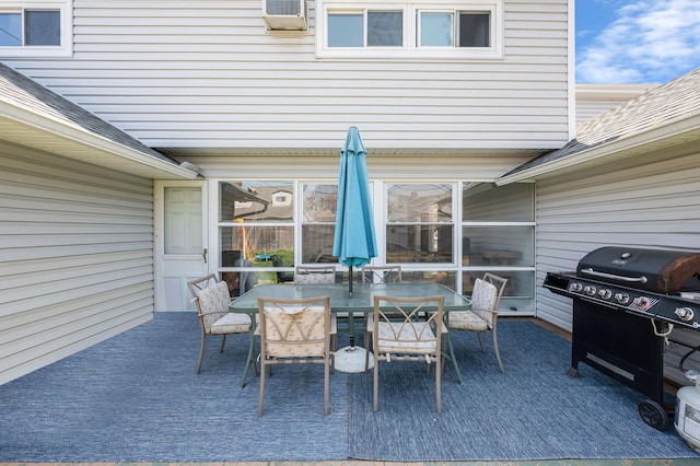 view of patio with area for grilling and outdoor dining space