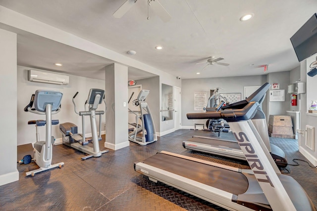 exercise room with baseboards, a wall unit AC, a ceiling fan, and recessed lighting