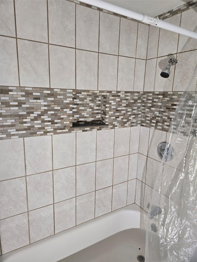 bathroom featuring shower / bath combination with curtain