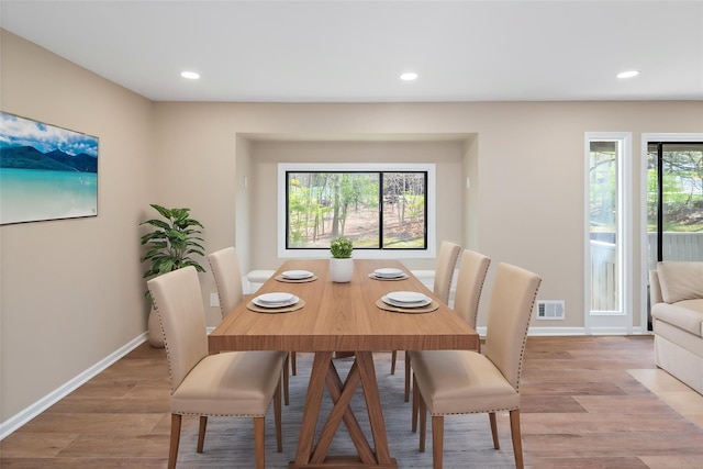 dining room featuring recessed lighting, baseboards, light wood-type flooring, and visible vents