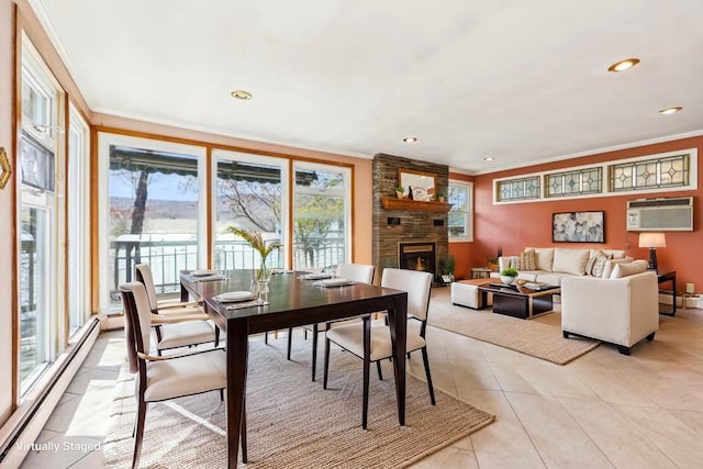 dining area featuring crown molding, plenty of natural light, a wall mounted AC, and baseboard heating