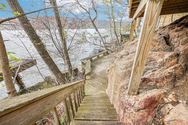 staircase with a water view
